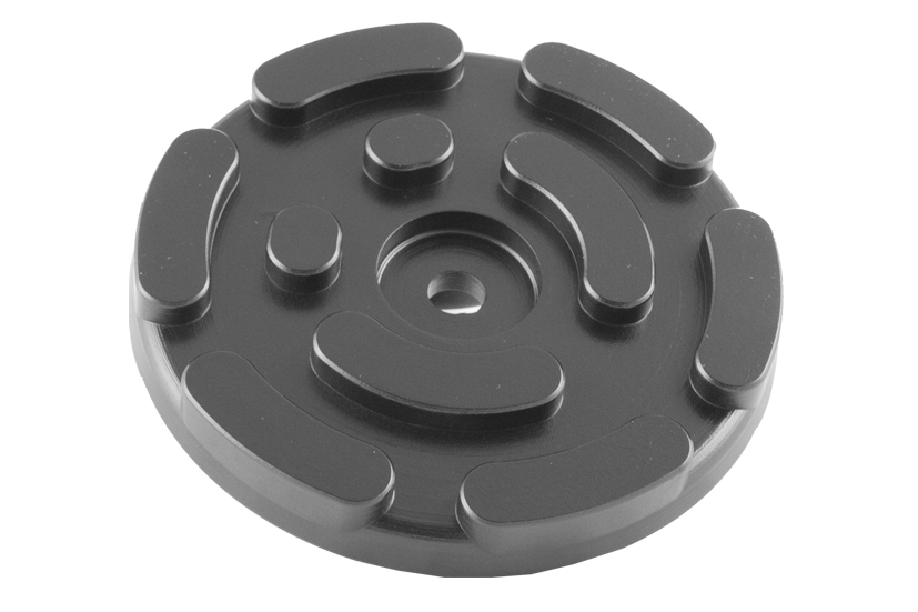 Front view of item GTCN008, a round black rubber pad with a central hole for bolting onto the lifting plate.