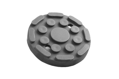 Front view of a black, round rubber pad (item no. 115172024) for vehicle lifts, with two holes and rubber lip for slipping over and bolting to the lift arm.