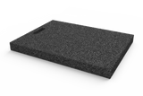 Angled view of the item AP-LUP.650.450.H50, rectangular black leveling pad for wheel alignment lifts with grip hole, made of recycled rubber with a porous surface.
