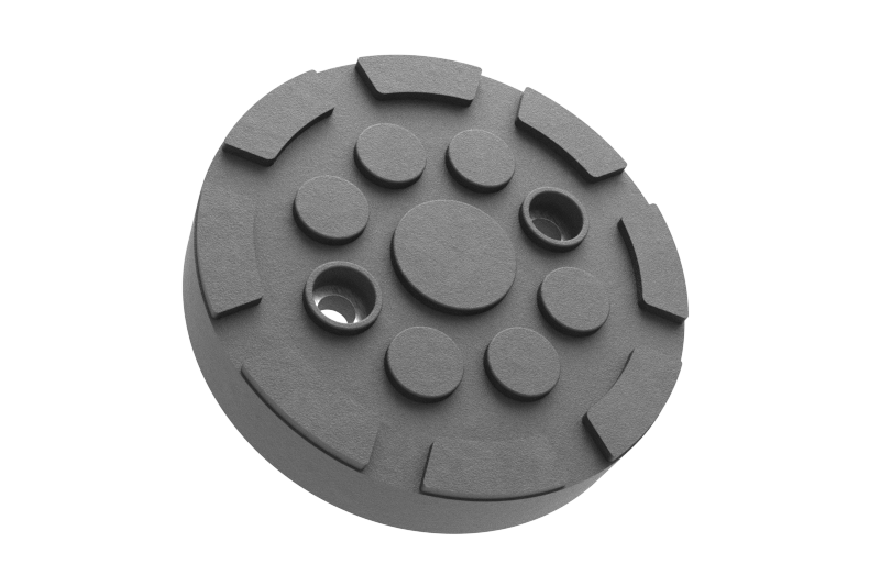 Front view of the black, round rubber pad GTCN010 for vehicle lifts with two holes for secure bolting to the lift arm.