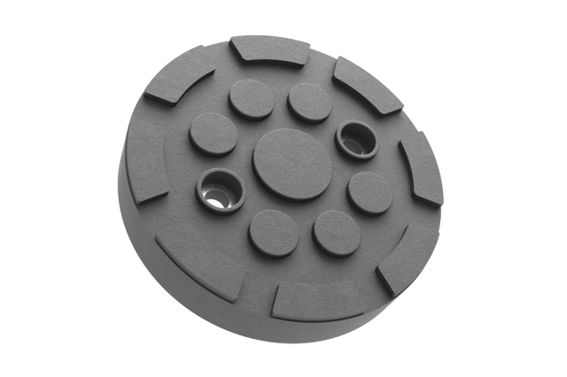 Front view of the black, round rubber pad GTCN010 for vehicle lifts with two holes for secure bolting to the lift arm.